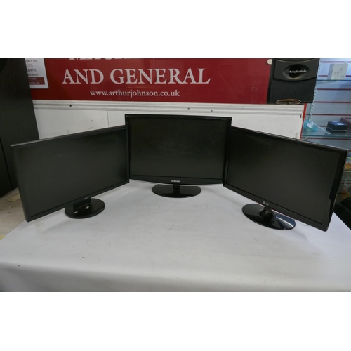 2170 - An Acer LCD monitor, a Samsung monitor and an LG monitor