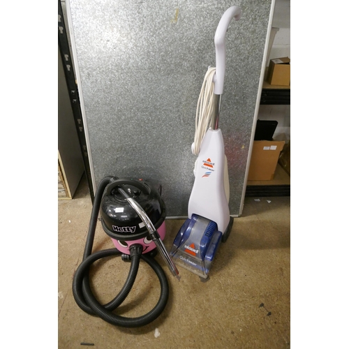 2173 - A pink Hetty numatic vacuum cleaner and a Bissell quickwash floor cleaner