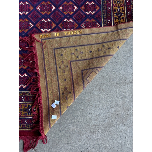 250 - Two Turkish red ground rugs