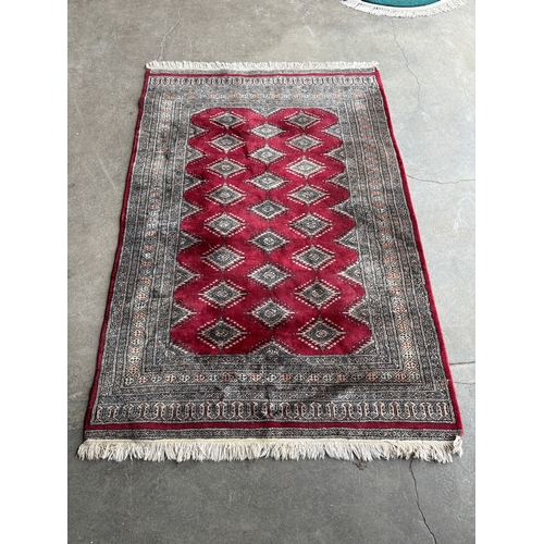 252 - An Eastern red ground rug