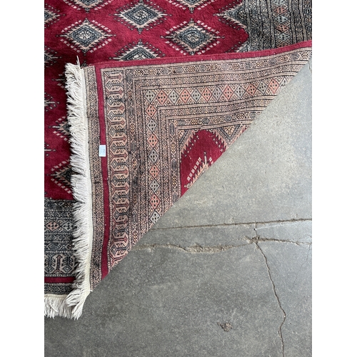 252 - An Eastern red ground rug