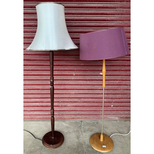 257 - A teak standard lamp and a mahogany standard lamp