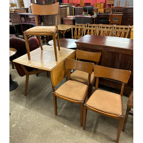 256 - A G-Plan Brandon oak drop leaf table and four chairs