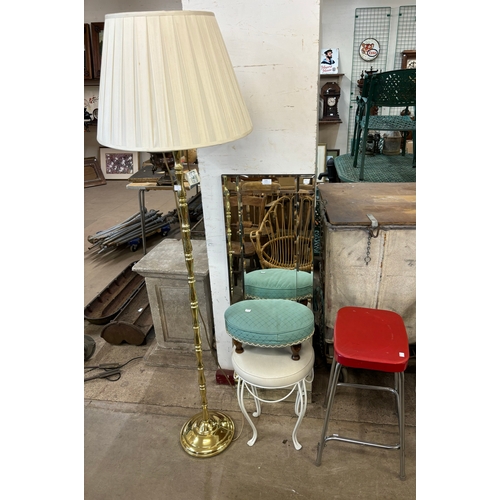 270 - A brass standard lamp, three stools and a mirror