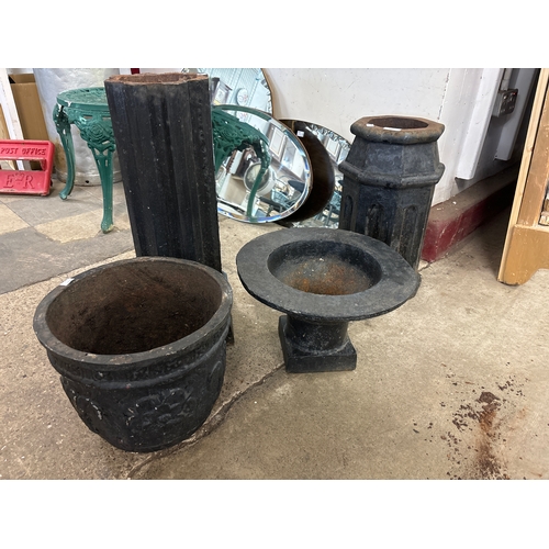 279 - Two cast iron pedestals and two cast iron planters