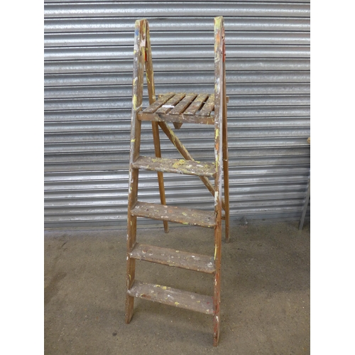 2214 - A wooden 5 rung step ladder, a set of 2 rung metal steps and two plastic foot stools/containers