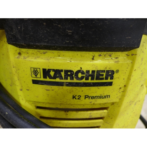 2234 - A Karcher K2 premium pressure washer with hose, lance and patio cleaner attachment