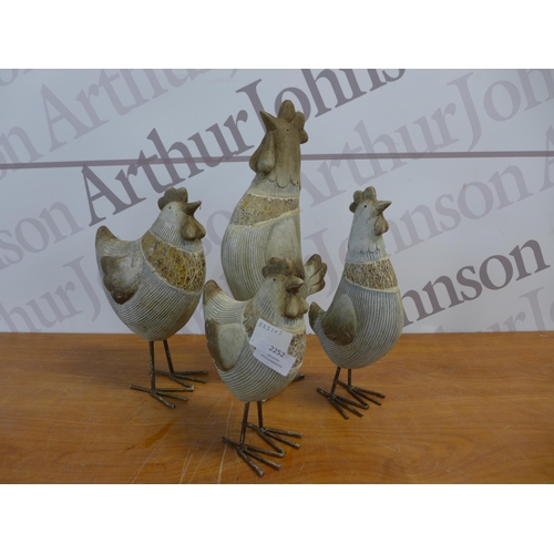 2252 - A set of four assorted sized chicken garden ornaments