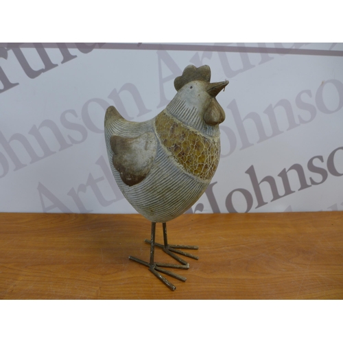 2252 - A set of four assorted sized chicken garden ornaments