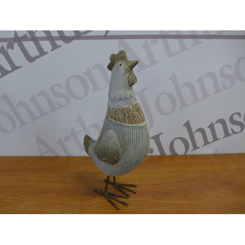 2252 - A set of four assorted sized chicken garden ornaments