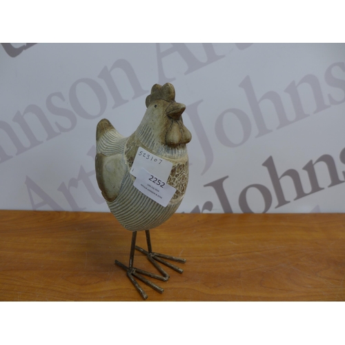 2252 - A set of four assorted sized chicken garden ornaments