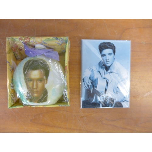 2299 - A crate of Elvis memorabilia including plates, mugs, posters, magazines, watches, wash set and two m... 