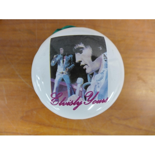 2299 - A crate of Elvis memorabilia including plates, mugs, posters, magazines, watches, wash set and two m... 