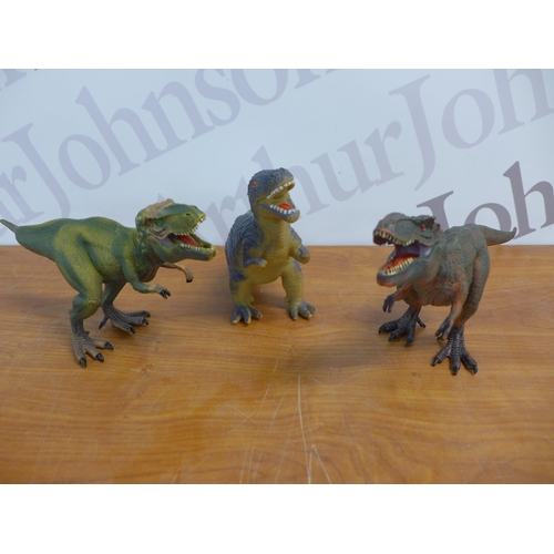 2301 - A selection of plastic dinosaur toys, a Natural History Museum Triceratops guide and a dinosaur stic... 