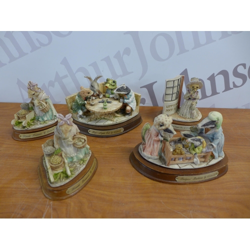 2302 - A crate of assorted ornaments including Leonardo and Pendelfin and two teapots