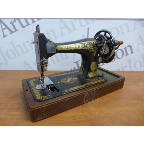 2319 - A Singer model EB604876 manually operated vintage sewing machine