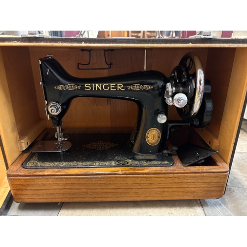 289 - A cased Singer sewing machine, E9866515