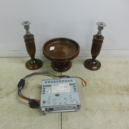 2052A - A Ripseed CMR2000 car radio/CD player and removable fascia, a pair of wooden candlesticks and a matc... 