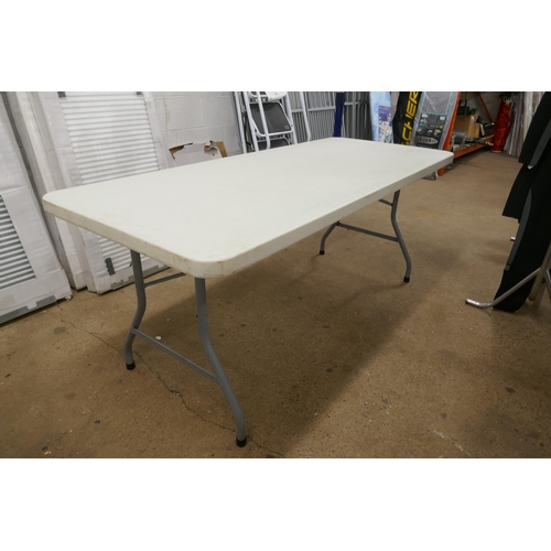 2381 - A 6ft heavy duty table with collapsible metal legs