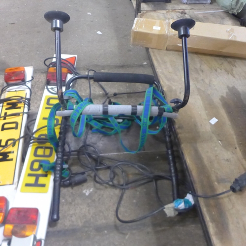 2401 - A tow hitch bike rack with 2 trailer boards and and one other bike rack