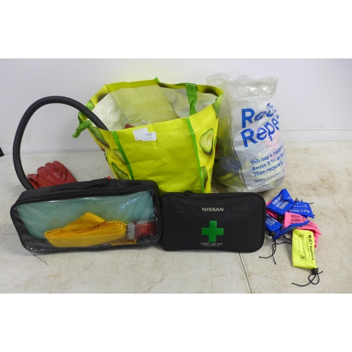 2412 - A quantity of vehicle related items including a Nissan first aid kit, emergency breakdown kit, cylin... 