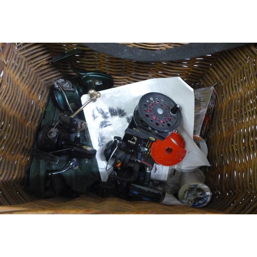 2420 - A quantity of vintage fishing tackle including five reels, four rods and other assorted items