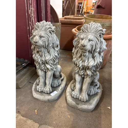 292 - A pair of concrete garden figures of seated lions