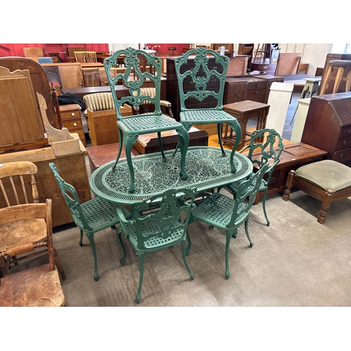 294 - A cast alloy garden table and six chairs including two carvers