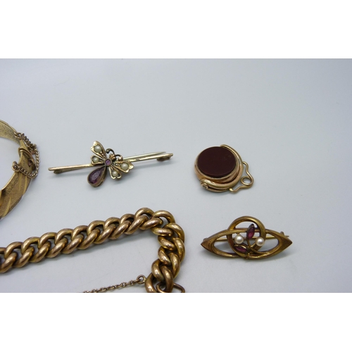 1009 - Victorian and later jewellery including a bracelet, bangle, two brooches and a swivel fob