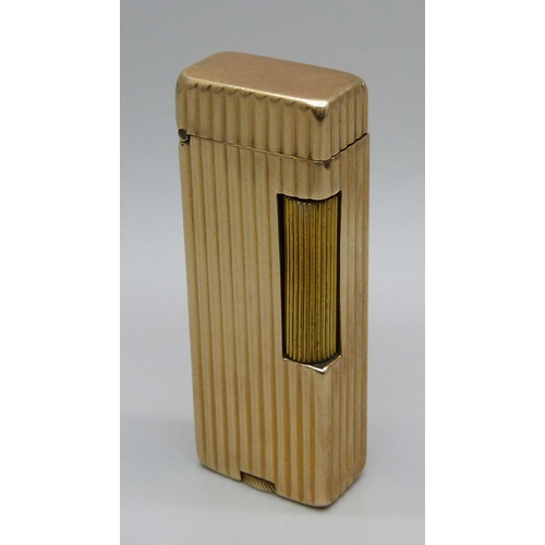 1017 - A Dunhill Rollalite 14k outer jacket petrol lighter