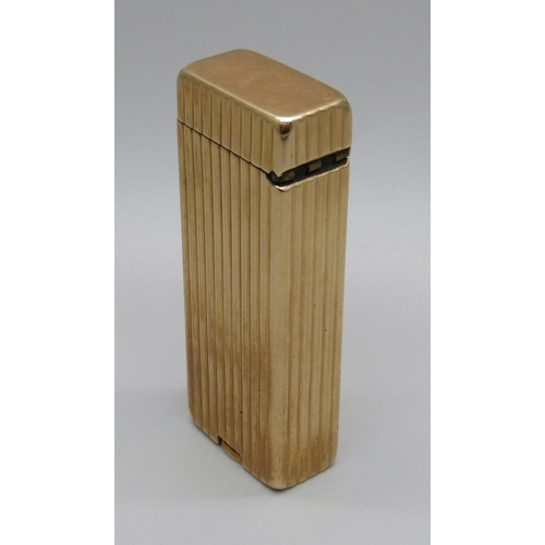 1017 - A Dunhill Rollalite 14k outer jacket petrol lighter