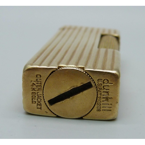 1017 - A Dunhill Rollalite 14k outer jacket petrol lighter