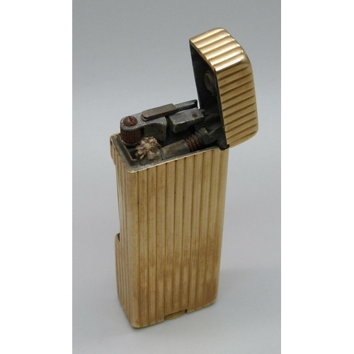 1017 - A Dunhill Rollalite 14k outer jacket petrol lighter