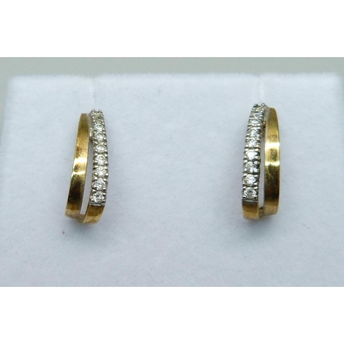 1063 - A pair of 9ct gold and diamond earrings, 1g