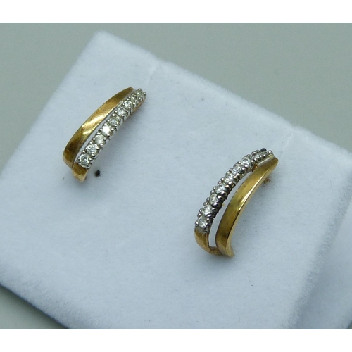 1063 - A pair of 9ct gold and diamond earrings, 1g