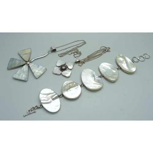 1066 - Two silver and mother of pearl pendants and chains and a silver mother of pearl bracelet