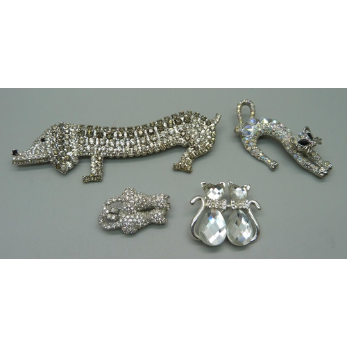 1067 - A paste set dog brooch and three cat brooches