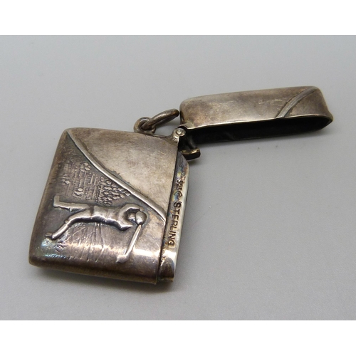 1072 - A silver vesta case with golfing scene