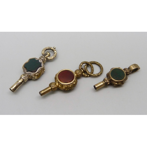 1075 - Three stone set fob watch keys, including carnelian and bloodstone