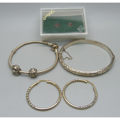 1078 - A pair of 9ct gold and garnet earrings, Pandora bracelet with two charms, silver bangle, etc.