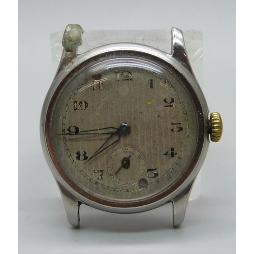 1102 - A Universal Geneve wristwatch head with inscription to case back