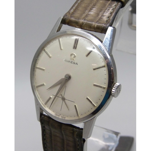 1117 - An Omega stainless steel cased wristwatch, glass scratched