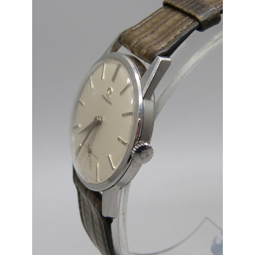 1117 - An Omega stainless steel cased wristwatch, glass scratched