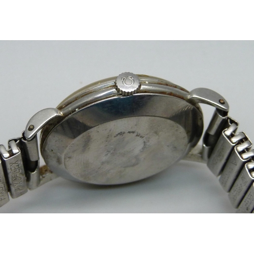 1120 - An Omega stainless steel wristwatch, possibly 1960, with subsidiary second hand (dial slightly stain... 