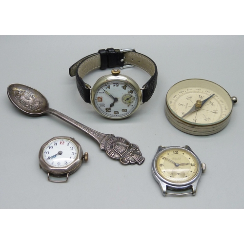 1124 - A silver trench watch, one other lady's silver wristwatch, a Helios wristwatch, Rolex spoon and comp... 