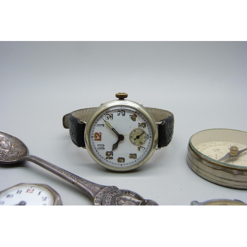 1124 - A silver trench watch, one other lady's silver wristwatch, a Helios wristwatch, Rolex spoon and comp... 