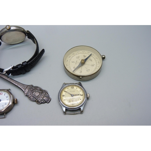 1124 - A silver trench watch, one other lady's silver wristwatch, a Helios wristwatch, Rolex spoon and comp... 