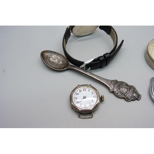 1124 - A silver trench watch, one other lady's silver wristwatch, a Helios wristwatch, Rolex spoon and comp... 