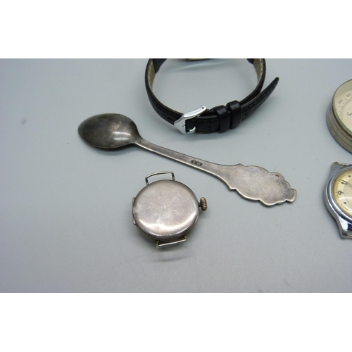 1124 - A silver trench watch, one other lady's silver wristwatch, a Helios wristwatch, Rolex spoon and comp... 