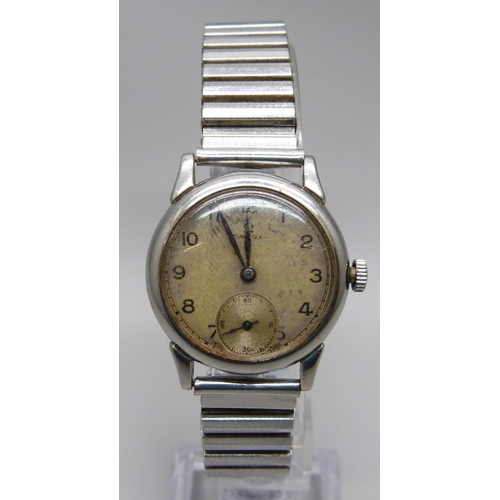 1125 - An Omega wristwatch with subsidiary second hand, new crown and inscribed back, probably 1950s